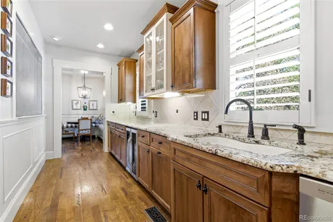 a bathroom with sink a vanity and a large mirror