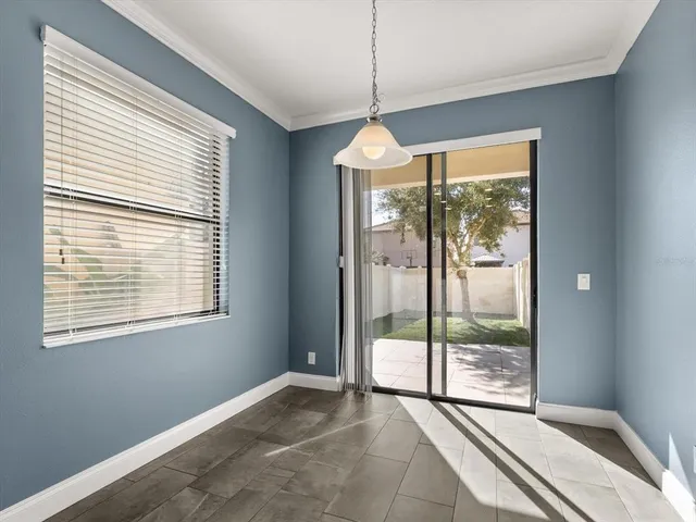 a view of an empty room with windows