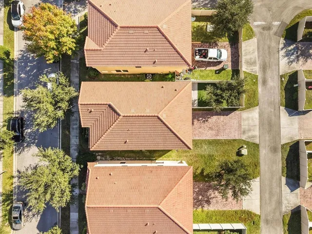 a aerial view of a house with a yard