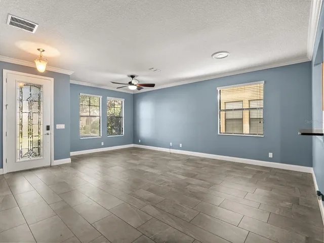a view of an empty room with a window