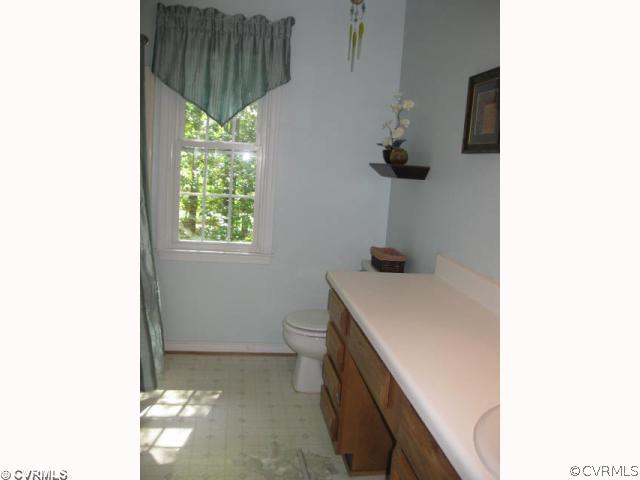 14212 River Road Chesterfield, VA 23838 - Photo 6 of 12 a bathroom with a sink and a mirror