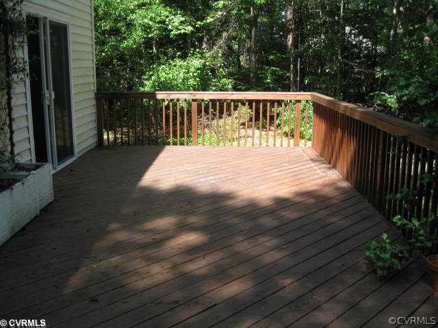14212 River Road Chesterfield, VA 23838 - Photo 10 of 12 a balcony with wooden floor in front of it