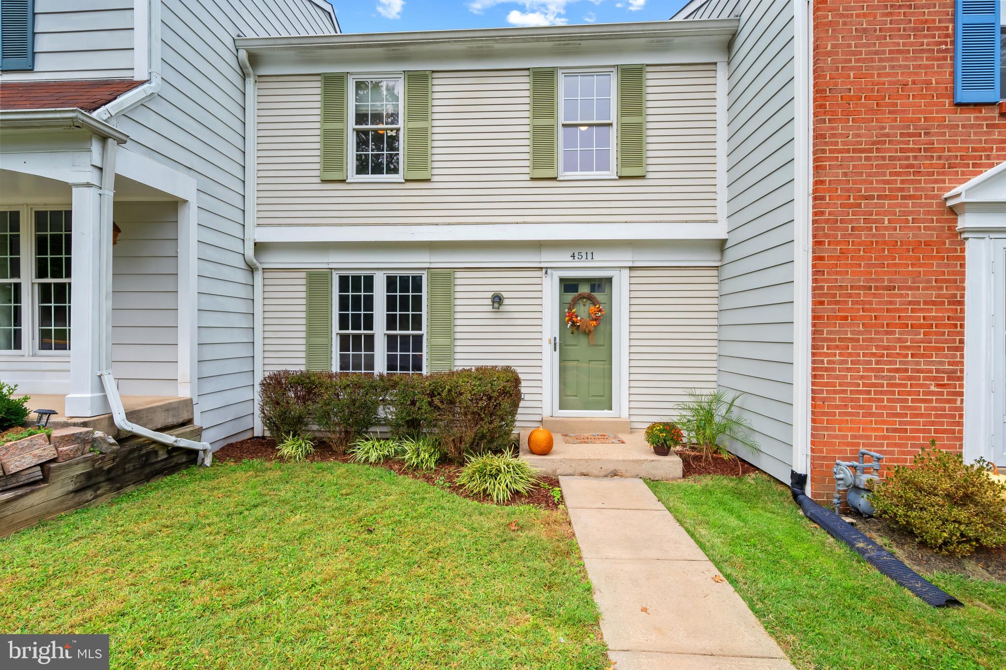 4511 Jenner Court Olney, MD 20832 - Photo 1 of 40 a front view of a house with garden