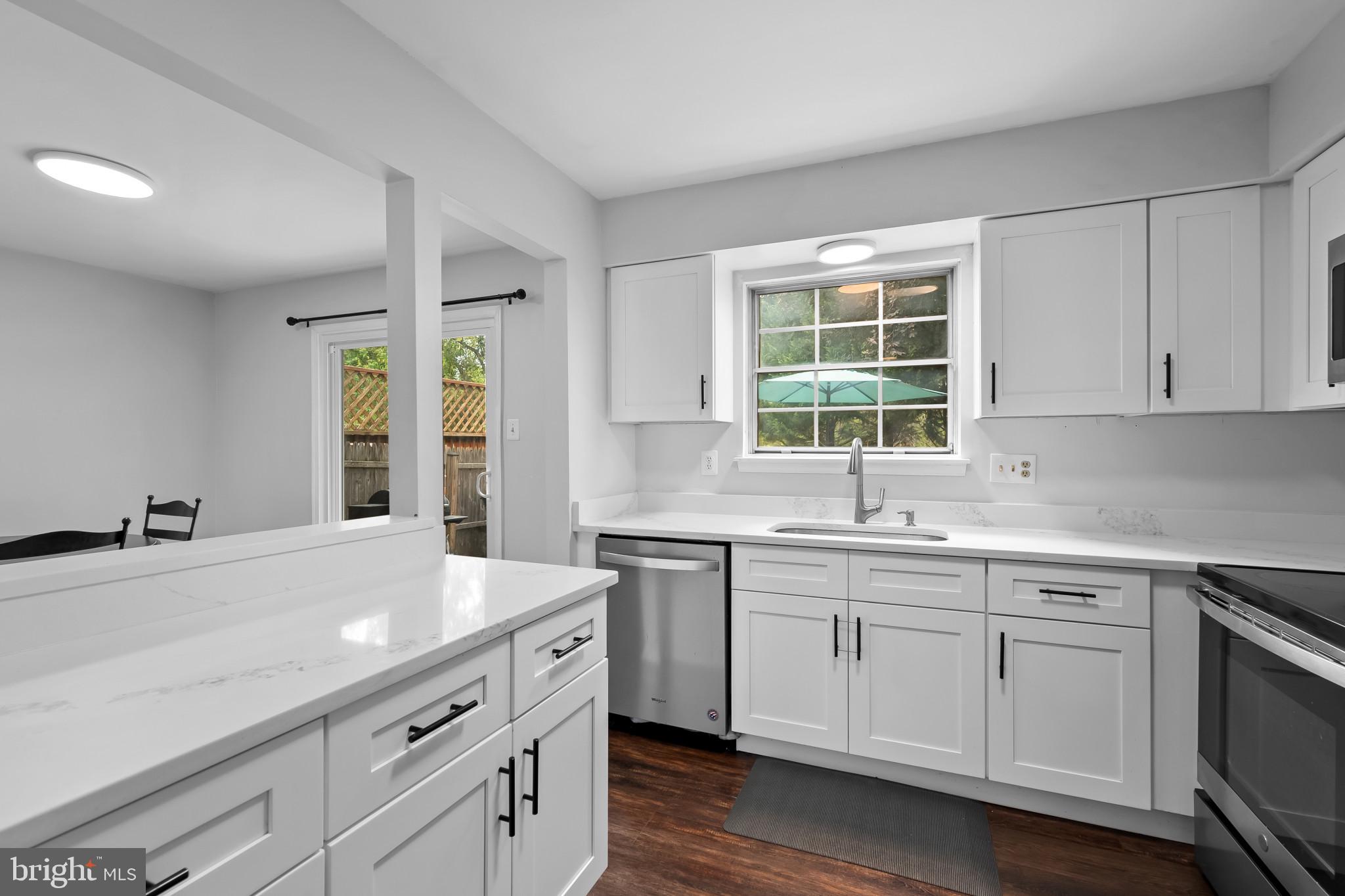 4511 Jenner Court Olney, MD 20832 - Photo 12 of 40 a kitchen with a sink cabinets and window