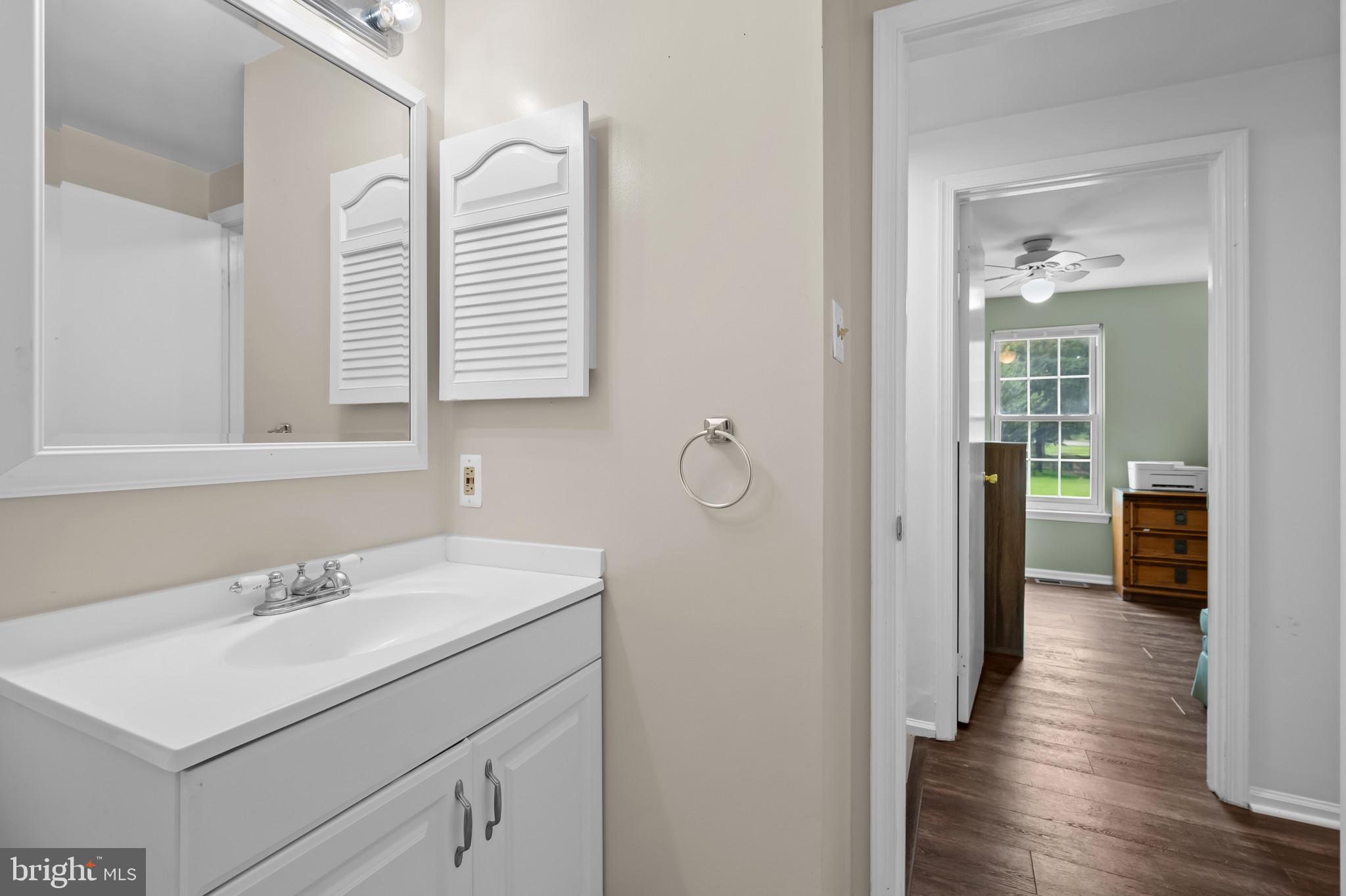 4511 Jenner Court Olney, MD 20832 - Photo 15 of 40 a bathroom with a sink and a mirror