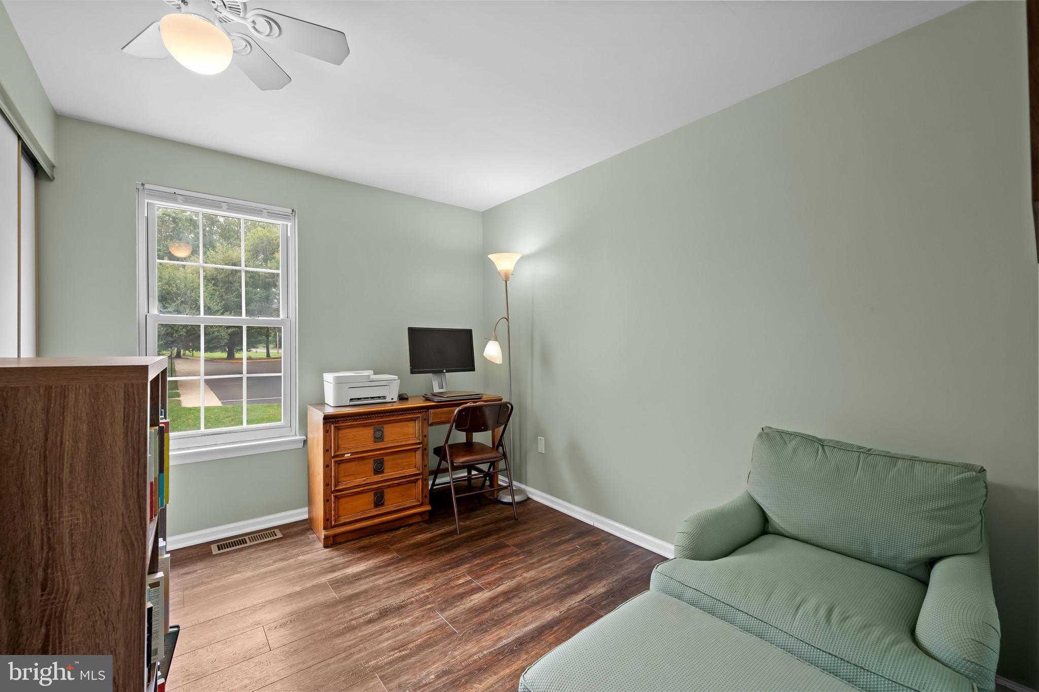 4511 Jenner Court Olney, MD 20832 - Photo 16 of 40 a living room with furniture and a flat screen tv
