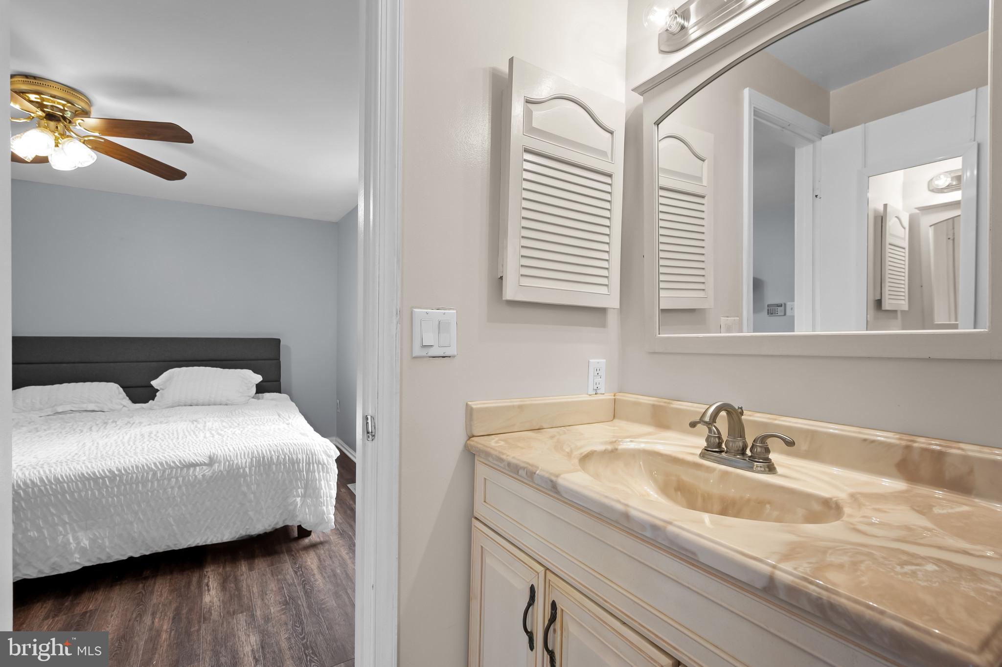 4511 Jenner Court Olney, MD 20832 - Photo 20 of 40 a en suite bathroom with a sink and a window