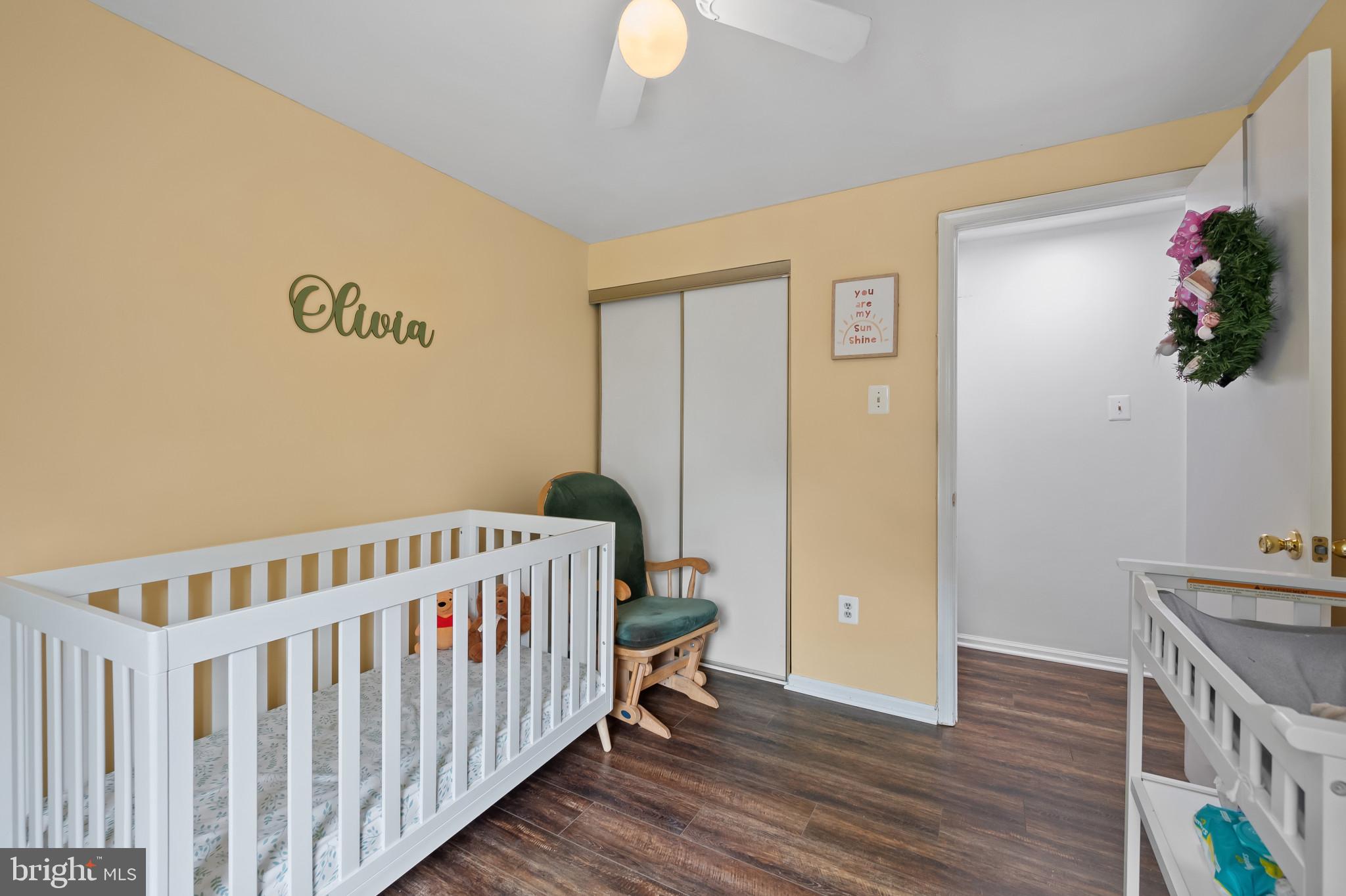 4511 Jenner Court Olney, MD 20832 - Photo 23 of 40 a bedroom with a bed and wooden floor