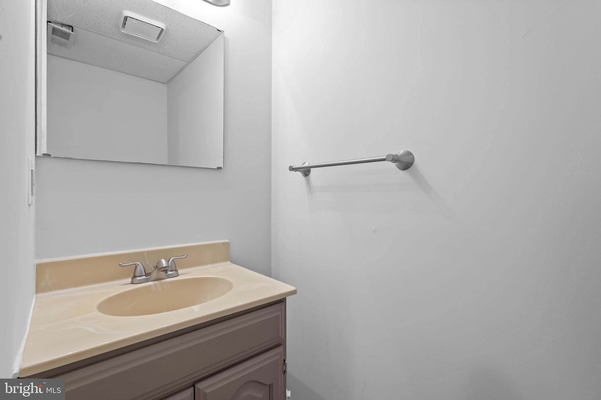 4511 Jenner Court Olney, MD 20832 - Photo 28 of 40 a bathroom with a sink and a mirror