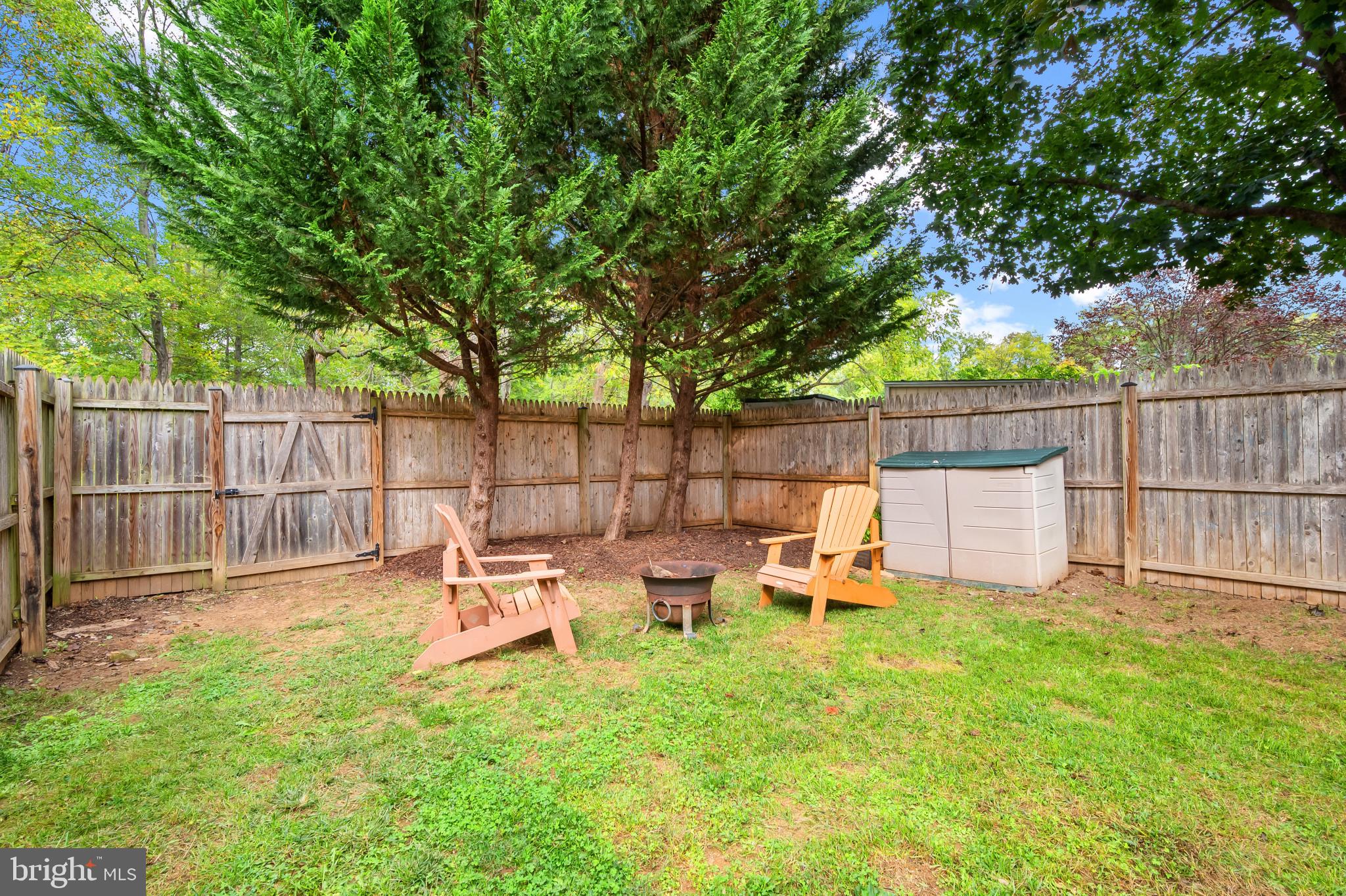 4511 Jenner Court Olney, MD 20832 - Photo 31 of 40 a backyard of a house with table and chairs