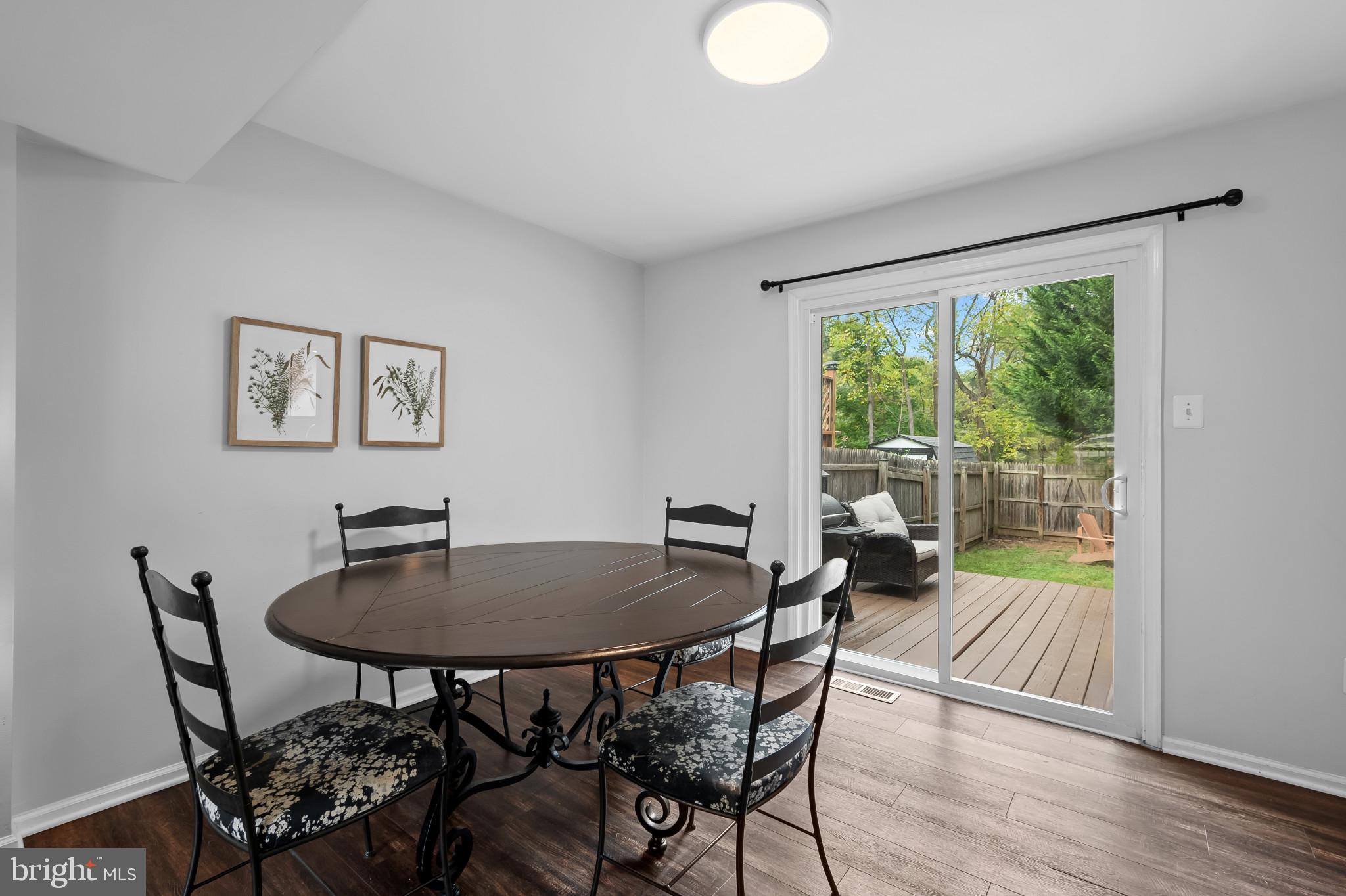 4511 Jenner Court Olney, MD 20832 - Photo 10 of 40 a view of a dining room with furniture window and wooden floor