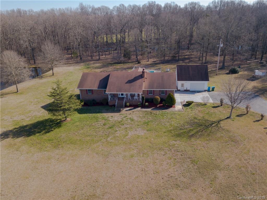 9003 Landsford Road Monroe, NC 28112 - Photo 14 of 21 a view of house with a yard covered with snow and trees
