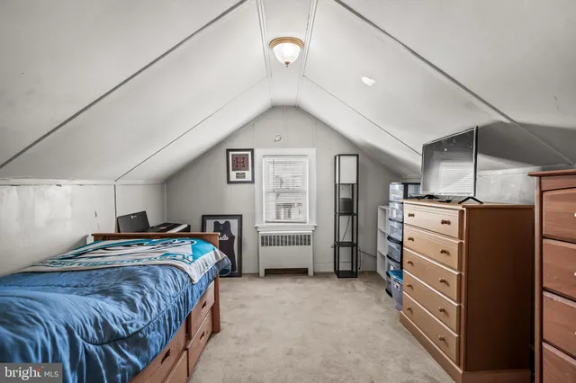a bedroom with a bed and a cabinets
