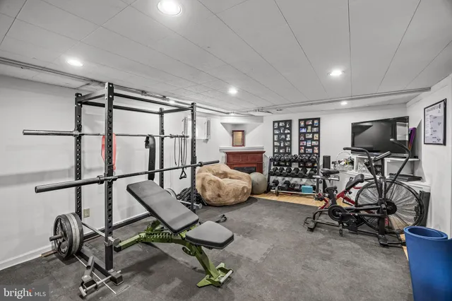 a room with gym equipment and a large window