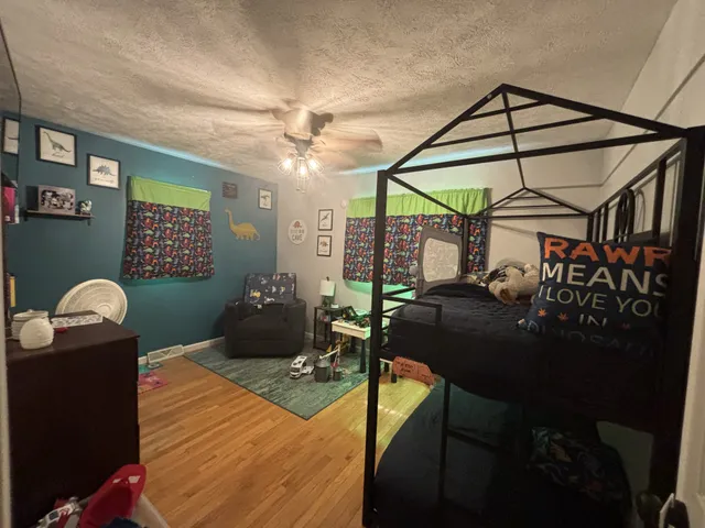 a living room with furniture a chandelier and a window