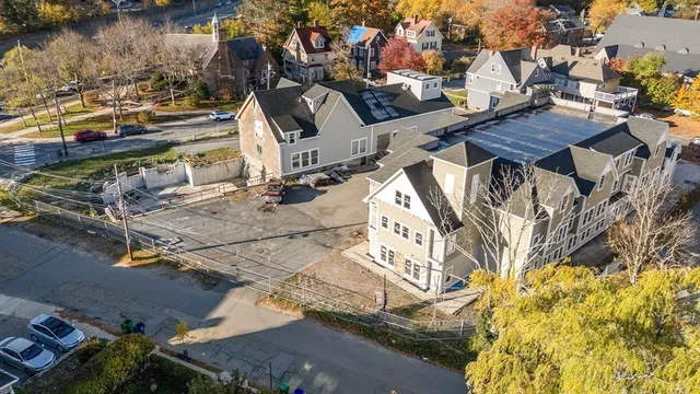 an aerial view of residential building with parking space