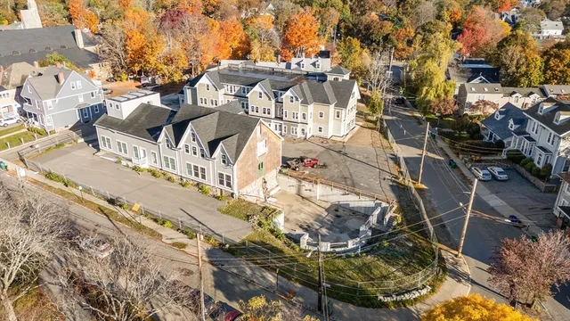 an aerial view of a houses with yard
