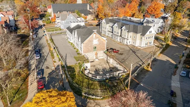 an aerial view of a house with outdoor space and street view