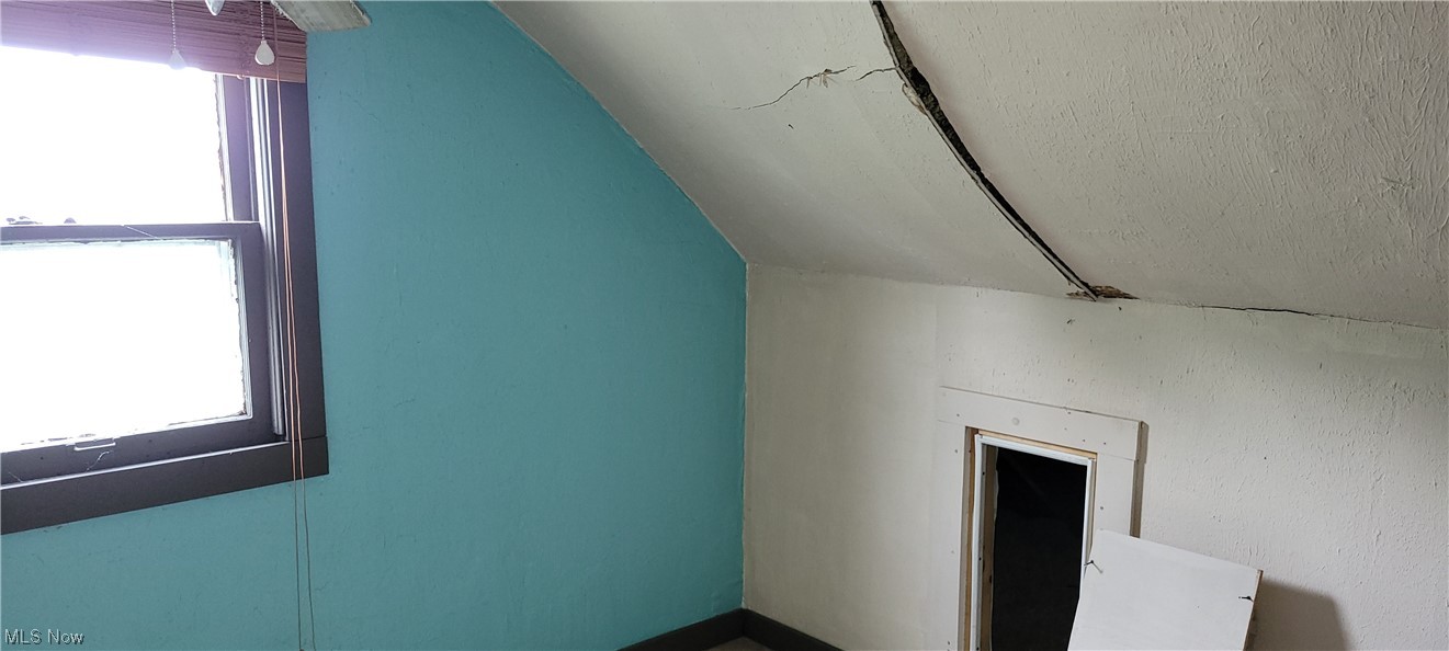 3936 Dunton Road Lorain, OH 44055 - Photo 32 of 35 Bonus room featuring a healthy amount of sunlight and lofted ceiling