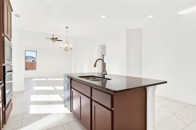 a bathroom with a sink a mirror and vanity