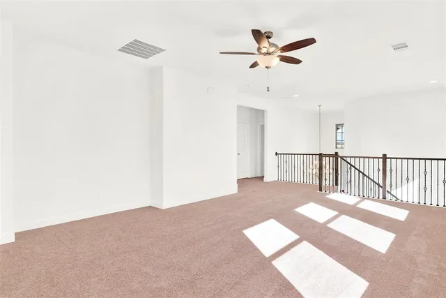 a view of a livingroom with a ceiling fan