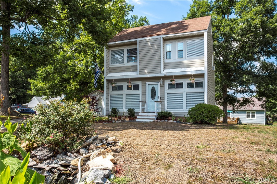 12406 Duck River Road Midlothian, VA 23112 - Photo 29 of 29 a front view of a house with a yard