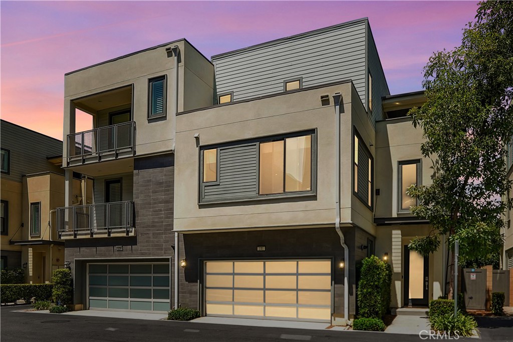 a front view of a house with a garage