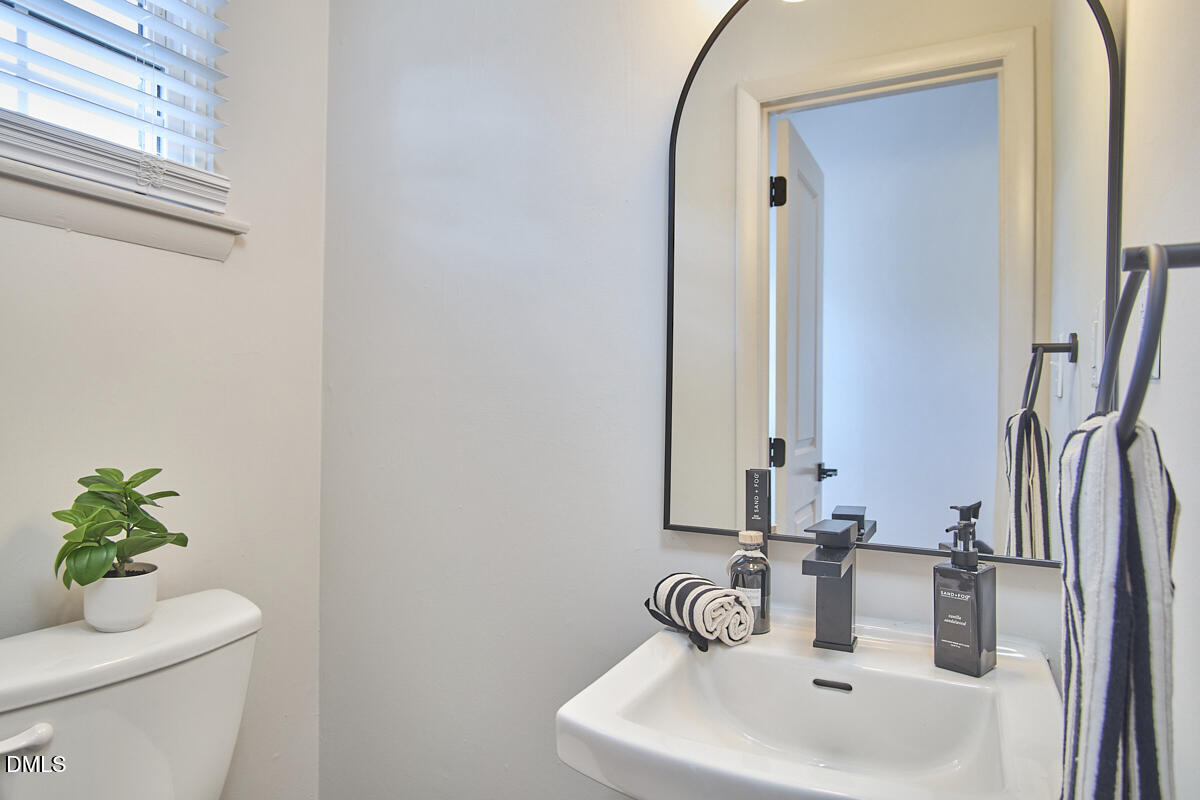 2613 McNeil Street, Unit B Raleigh, NC 27608 - Photo 19 of 31 a bathroom with a sink and a toilet