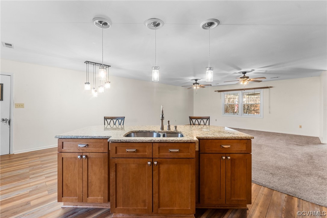 10083 Burkes Pond Road North, VA 23128 - Photo 11 of 36 a spacious bathroom with a granite countertop sink a mirror and a vanity