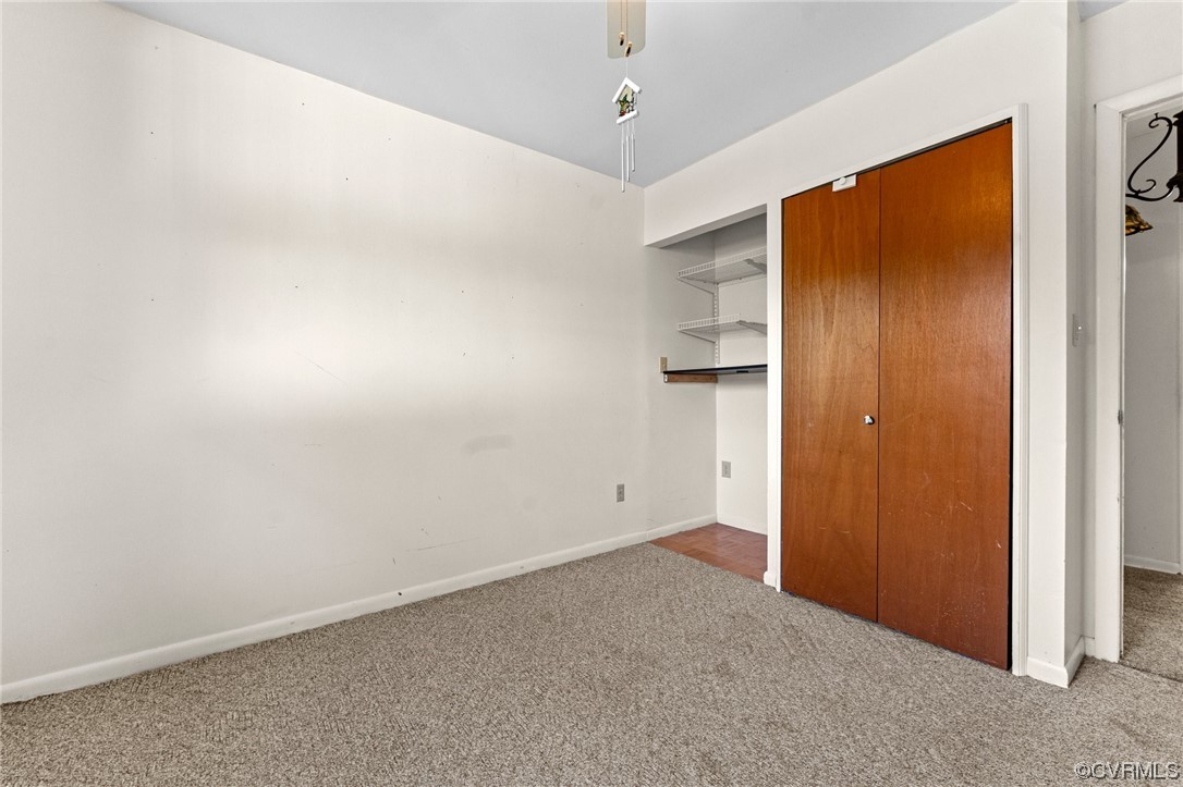 10083 Burkes Pond Road North, VA 23128 - Photo 18 of 36 an empty room with closet area