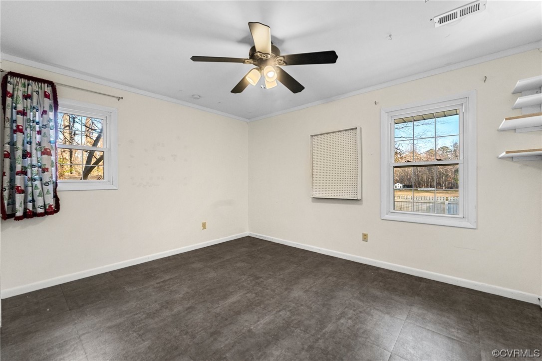 10083 Burkes Pond Road North, VA 23128 - Photo 20 of 36 a view of an empty room with ceiling fan