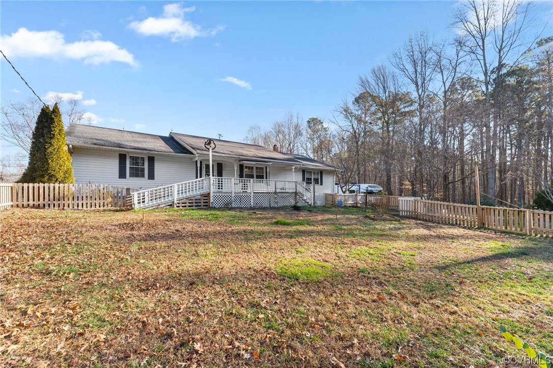 10083 Burkes Pond Road North, VA 23128 - Photo 2 of 36 a swimming pool with outdoor seating and yard