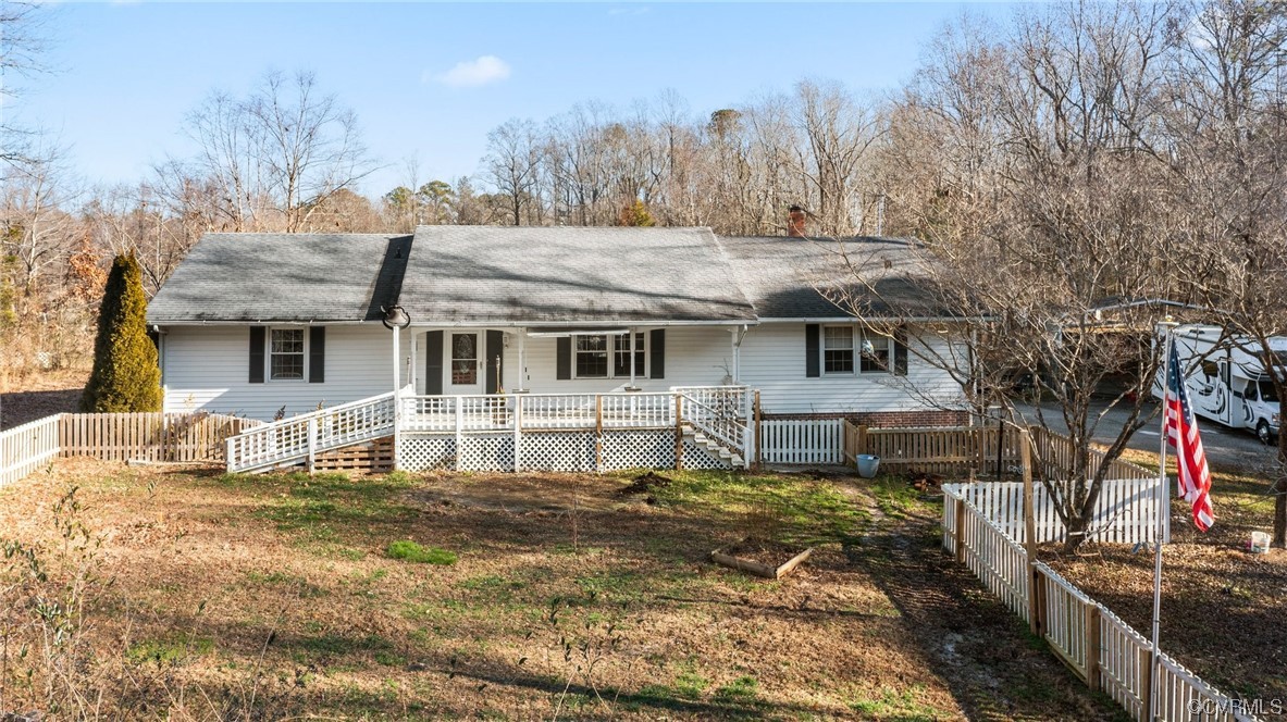10083 Burkes Pond Road North, VA 23128 - Photo 3 of 36 a view of a house with a bed and a yard