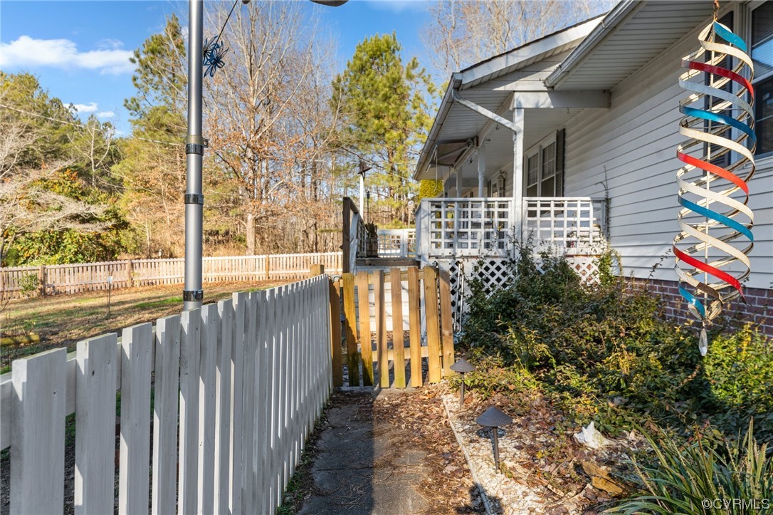 10083 Burkes Pond Road North, VA 23128 - Photo 33 of 36 a front view of a house with a garden