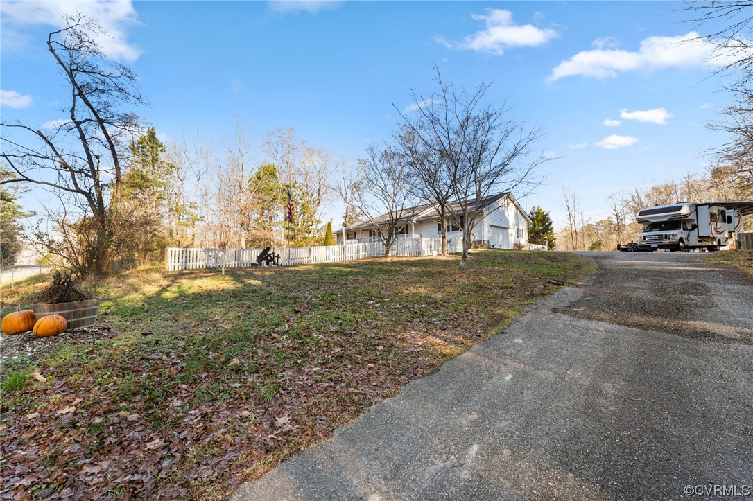 10083 Burkes Pond Road North, VA 23128 - Photo 36 of 36 a view of a yard with a house