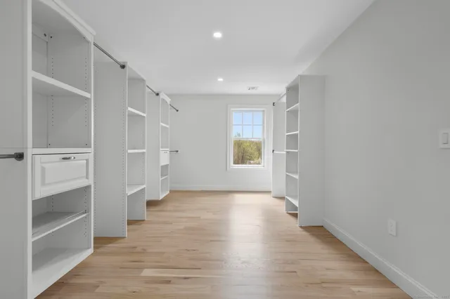 a bathroom with a sink a toilet and a shower
