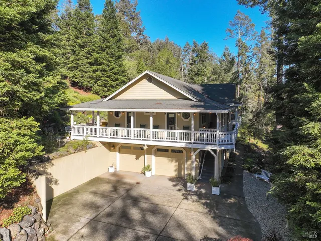 a house with swimming pool in front of it