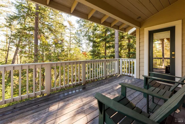a view of a two chairs in the balcony