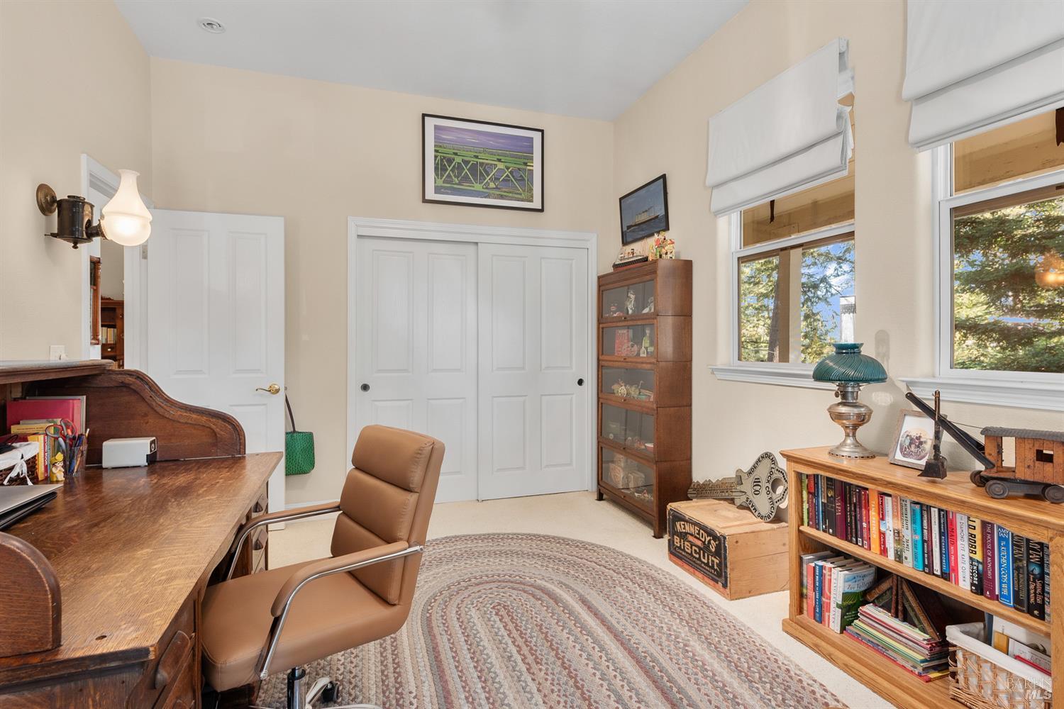 1885 Los Olivos Road Santa Rosa, CA 95404 - Photo 30 of 47 a bedroom with furniture and a book shelf