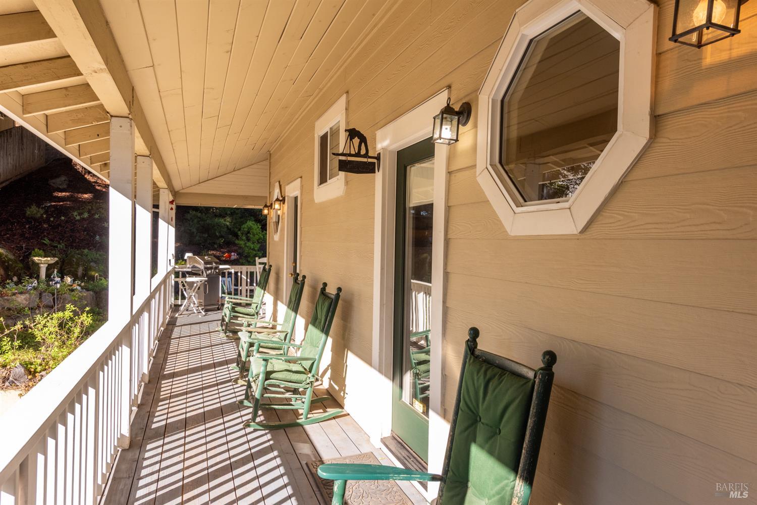 1885 Los Olivos Road Santa Rosa, CA 95404 - Photo 32 of 47 a view of a balcony with furniture and wooden floor