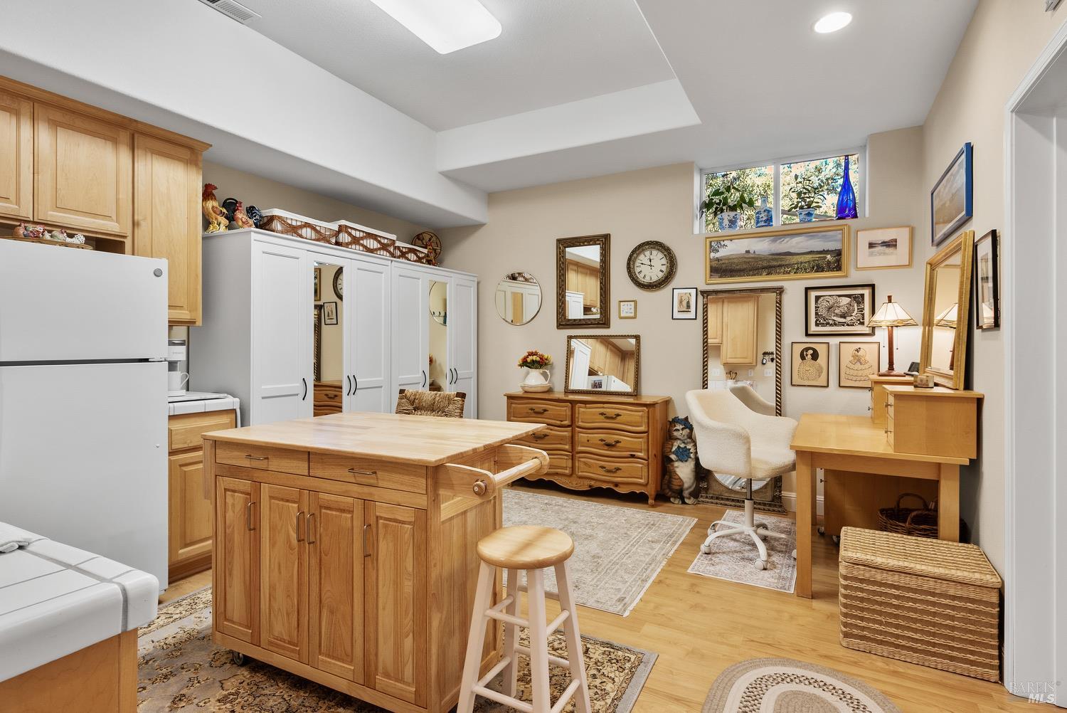 1885 Los Olivos Road Santa Rosa, CA 95404 - Photo 38 of 47 a living room with furniture a rug and a refrigerator