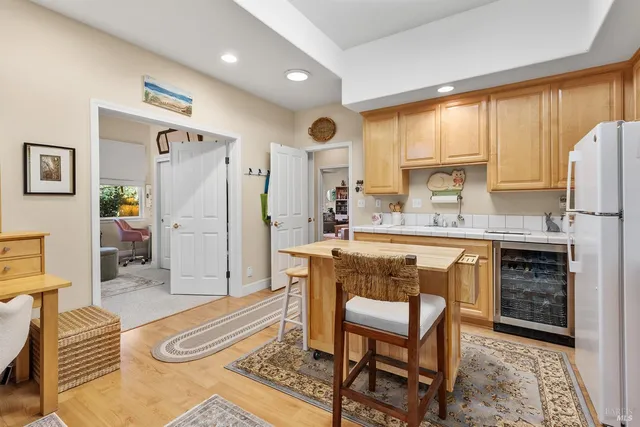 a living room with kitchen island furniture and a fireplace