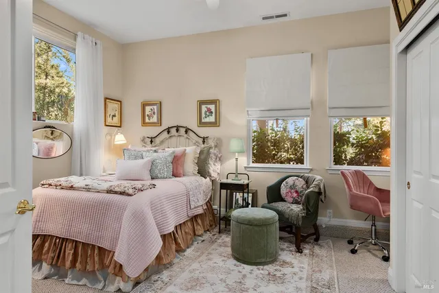 a bedroom with a bed and a table