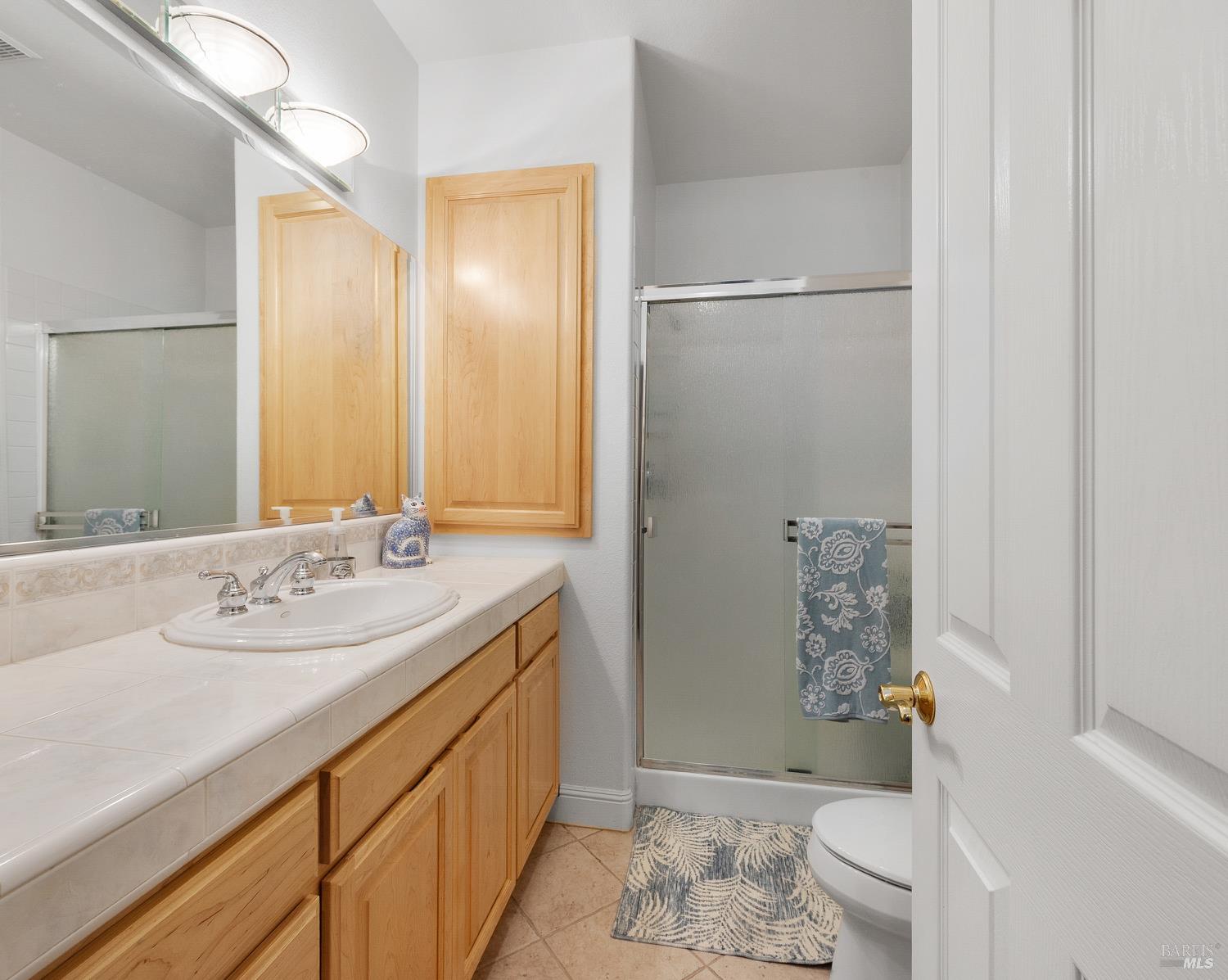 1885 Los Olivos Road Santa Rosa, CA 95404 - Photo 43 of 47 a bathroom with a sink toilet and shower
