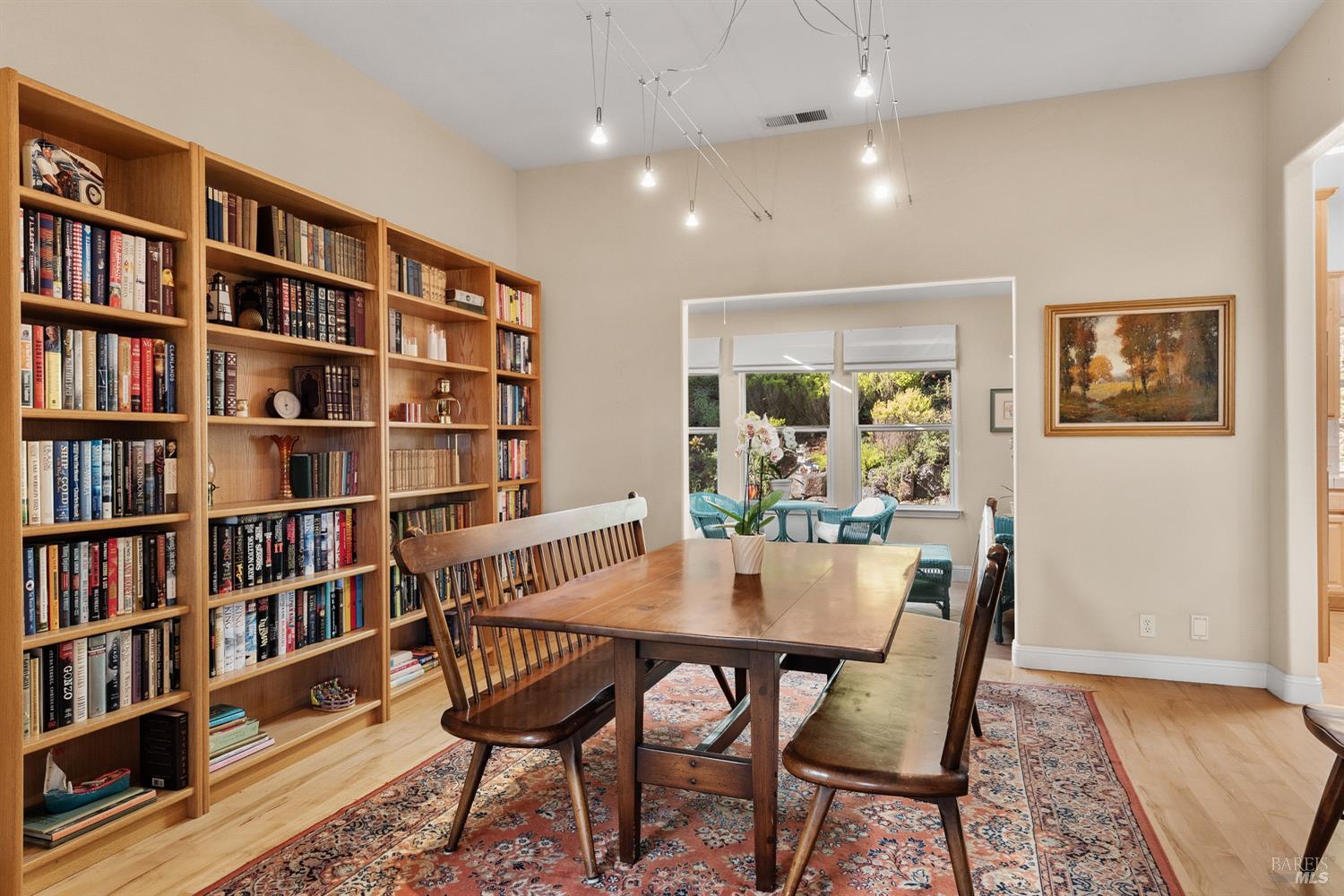1885 Los Olivos Road Santa Rosa, CA 95404 - Photo 9 of 47 a view of a dining room with furniture and a book shelf