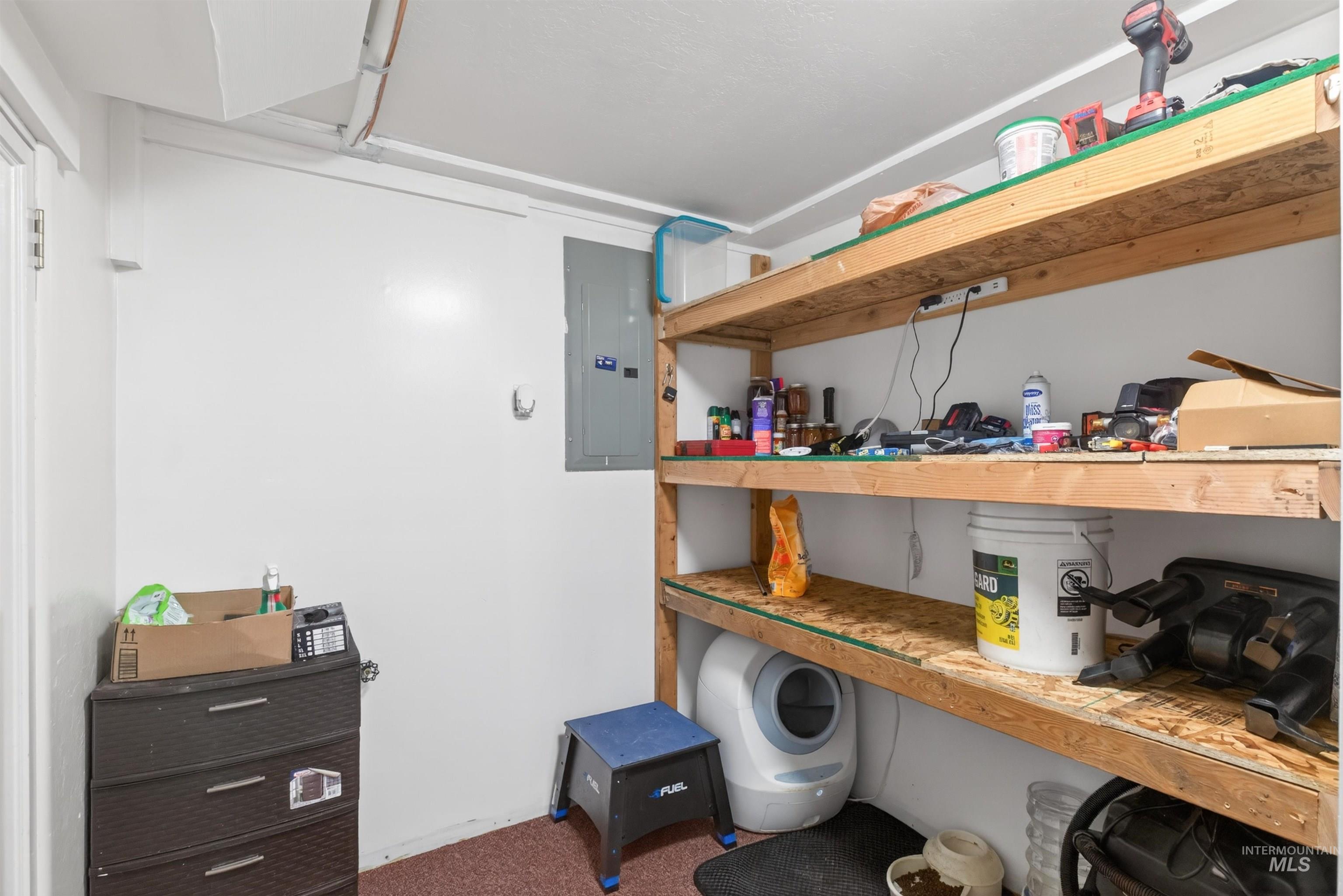 247 North Beech Street Genesee, ID 83832 - Photo 25 of 27 Utility room featuring white walls and built-in wood shelving for storage