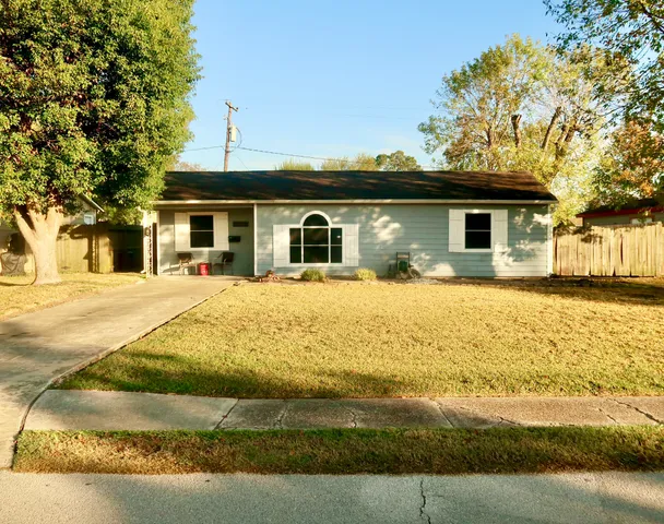 a view of a house with snow on the background