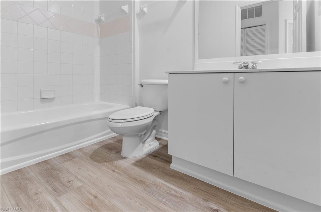 3281 Lindsey Lane, Unit 55 Naples, FL 34109 - Photo 24 of 43 a bathroom with a toilet and a shower