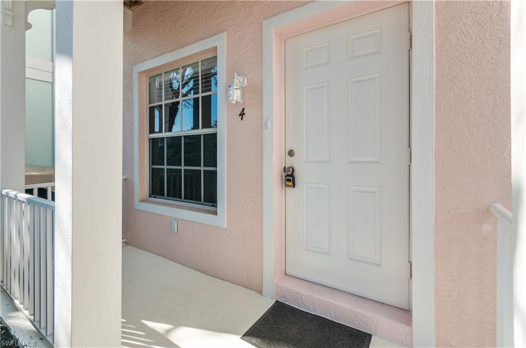 3281 Lindsey Lane, Unit 55 Naples, FL 34109 - Photo 27 of 43 a view of front door of a house