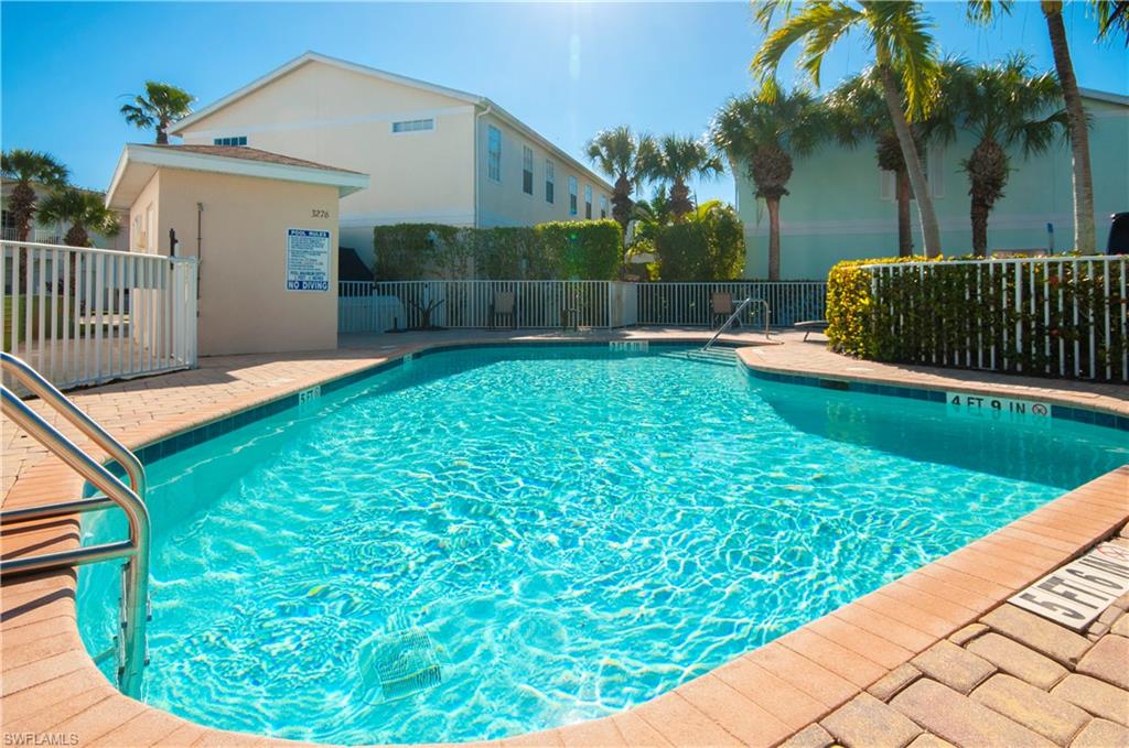 3281 Lindsey Lane, Unit 55 Naples, FL 34109 - Photo 36 of 43 a view of a backyard with a garden